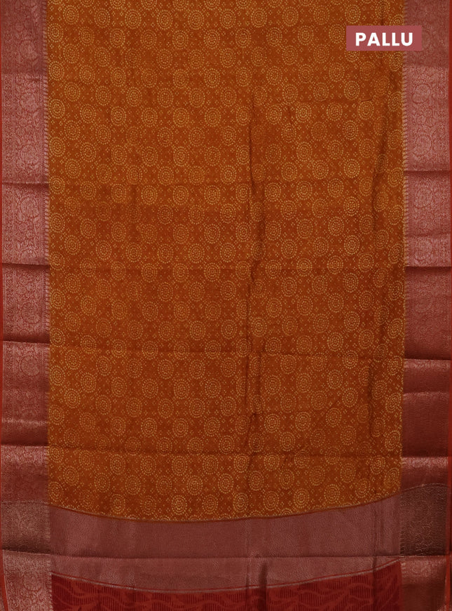Chanderi silk cotton saree dark mustard and rust shade with allover prints and banarasi style border