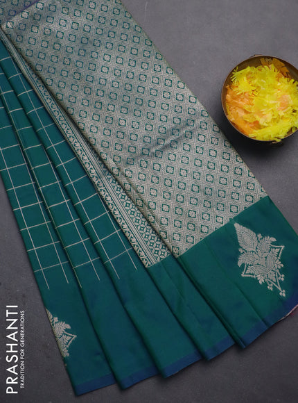 Semi soft silk saree dual shade of greenish blue with allover zari woven checked pattern and zari woven butta border