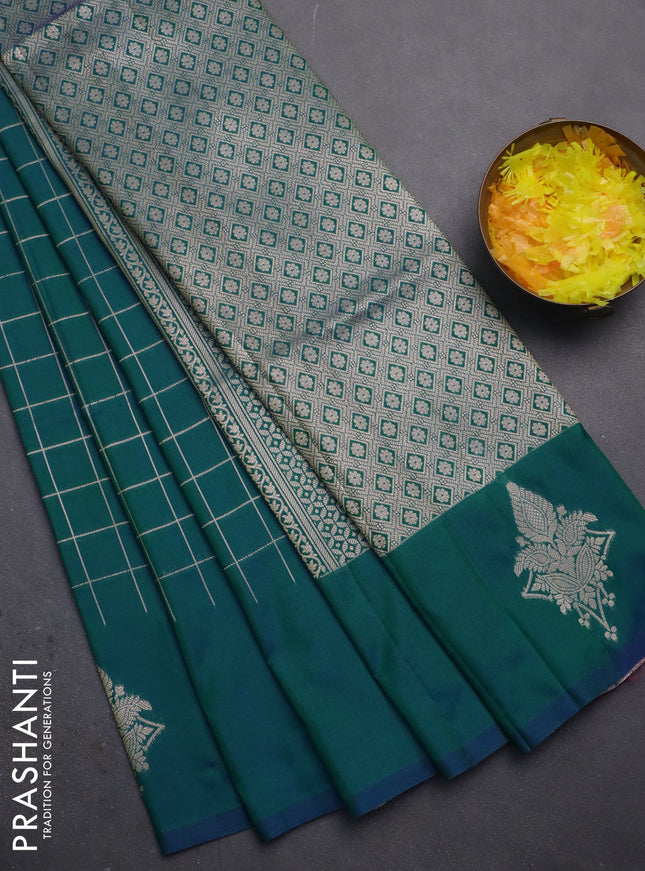 Semi soft silk saree dual shade of greenish blue with allover zari woven checked pattern and zari woven butta border