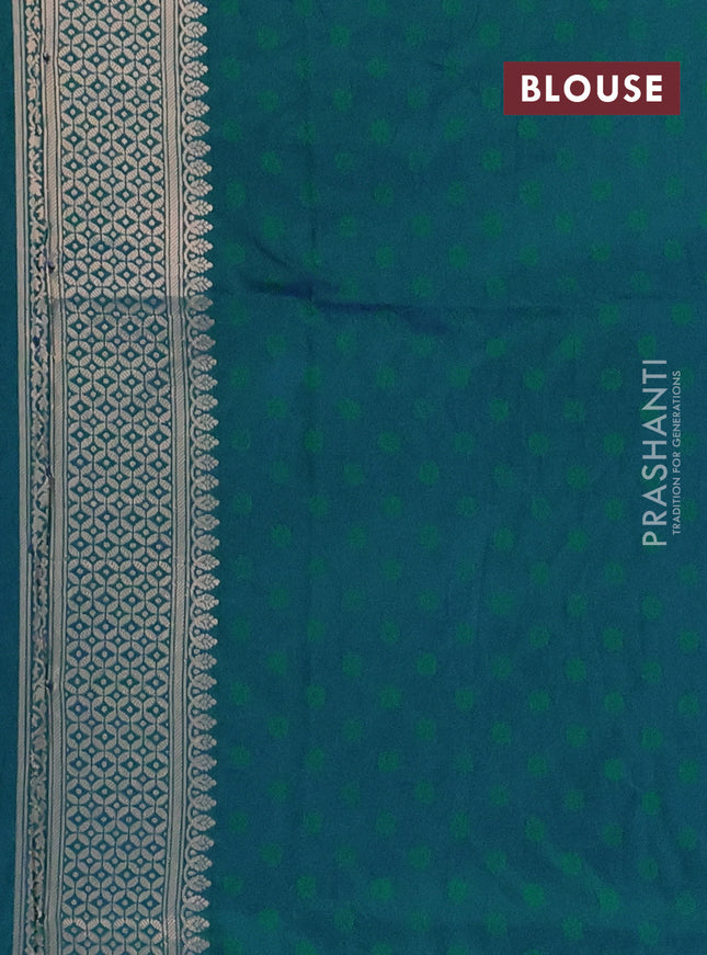 Semi soft silk saree dual shade of greenish blue with allover zari woven checked pattern and zari woven butta border