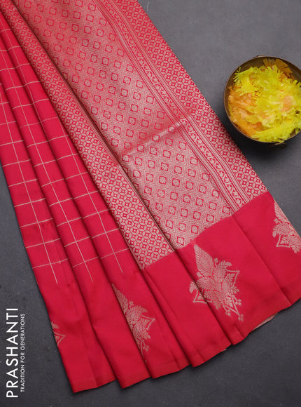 Semi soft silk saree pink with allover zari woven checked pattern and zari woven butta border