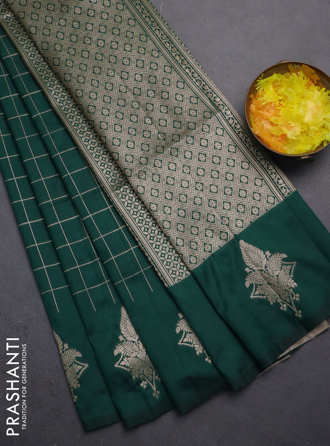 Semi soft silk saree green with allover zari woven checked pattern and zari woven butta border