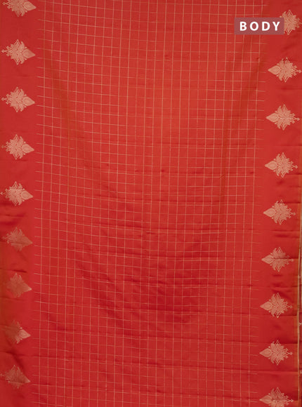 Semi soft silk saree dual shade of pinkish orange with allover zari woven checked pattern and zari woven butta border