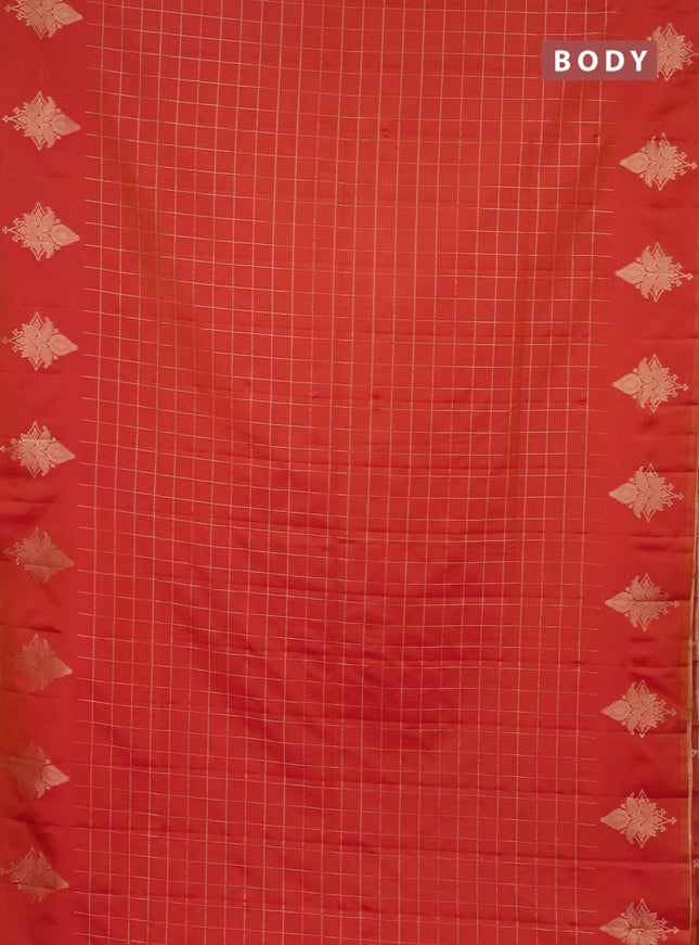 Semi soft silk saree dual shade of pinkish orange with allover zari woven checked pattern and zari woven butta border