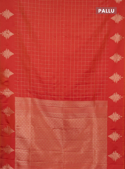 Semi soft silk saree dual shade of pinkish orange with allover zari woven checked pattern and zari woven butta border