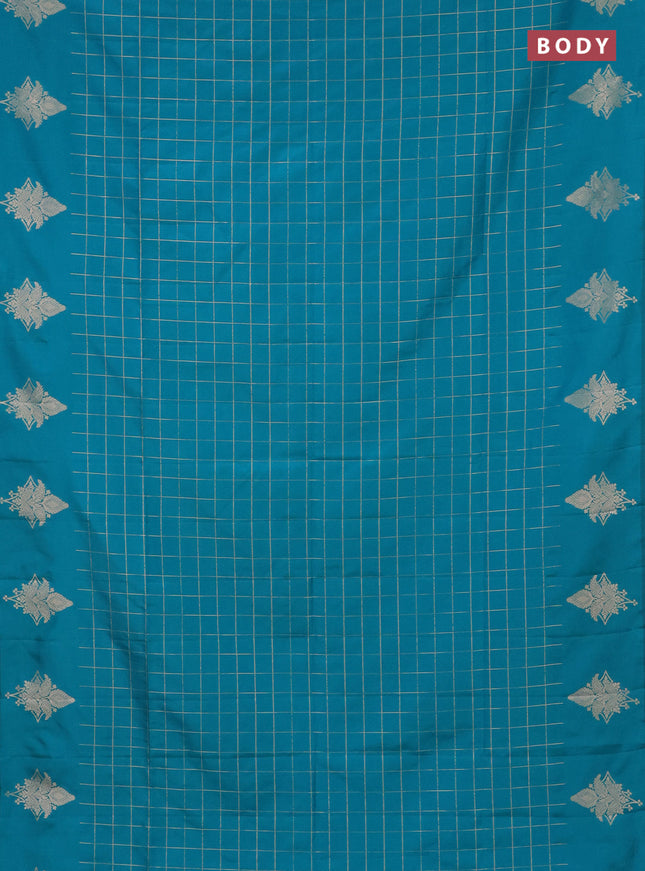 Semi soft silk saree teal blue shade with allover zari woven checked pattern and zari woven butta border