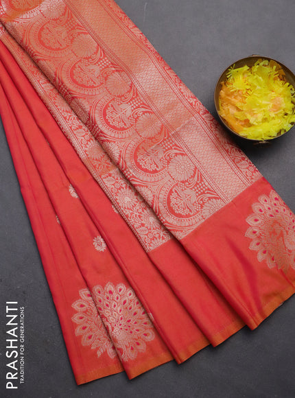 Semi soft silk saree dual shade of pinkish orange with zari woven buttas and zari woven peacock butta border