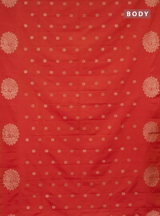 Semi soft silk saree dual shade of pinkish orange with zari woven buttas and zari woven peacock butta border
