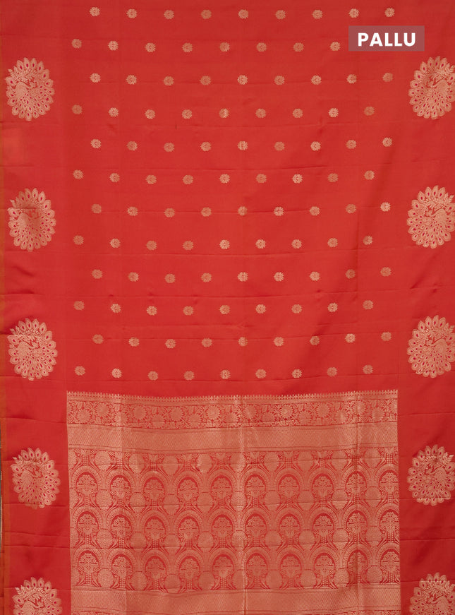 Semi soft silk saree dual shade of pinkish orange with zari woven buttas and zari woven peacock butta border