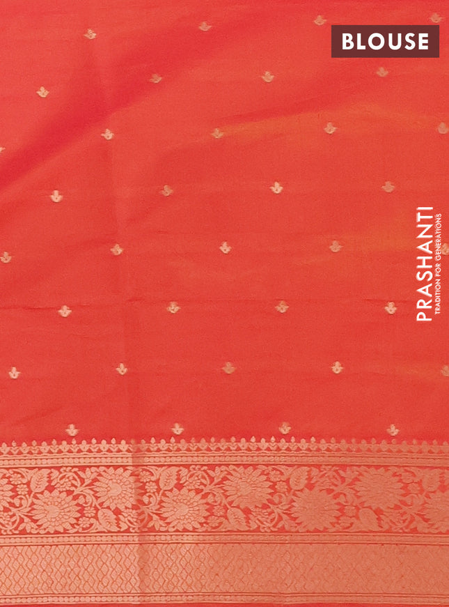 Semi soft silk saree dual shade of pinkish orange with zari woven buttas and zari woven peacock butta border