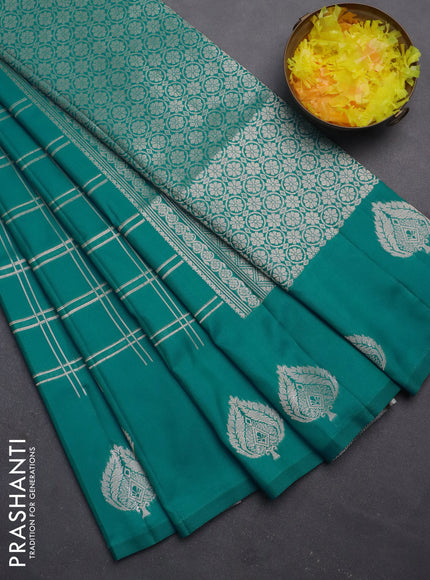 Semi soft silk saree teal blue with allover zari checked pattern and zari woven butta border