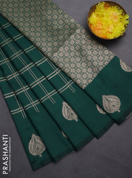 Semi soft silk saree dark green with allover zari checked pattern and zari woven butta border