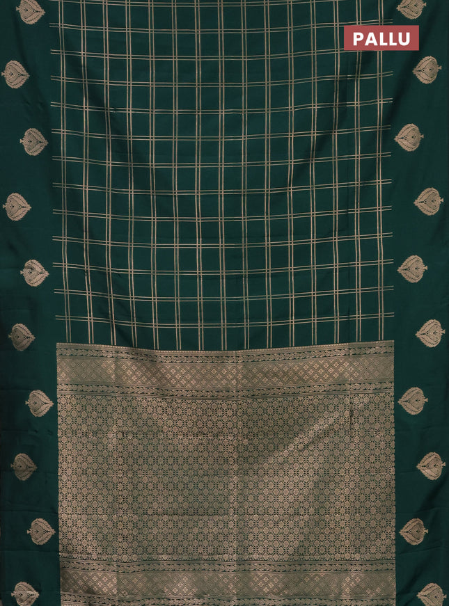Semi soft silk saree dark green with allover zari checked pattern and zari woven butta border