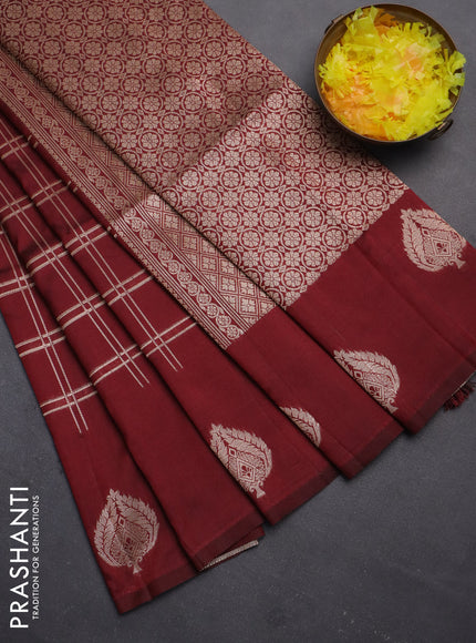 Semi soft silk saree maroon with allover zari checked pattern and zari woven butta border