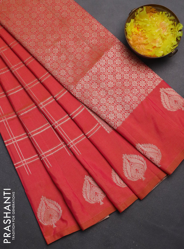 Semi soft silk saree dual shade of pinkish orange with allover zari checked pattern and zari woven butta border