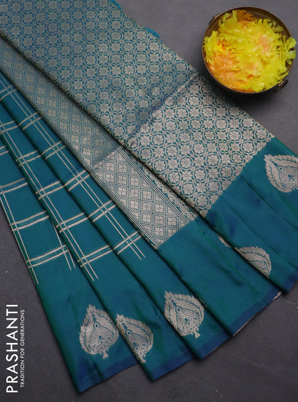 Semi soft silk saree dual shade of bluish green with allover zari checked pattern and zari woven butta border