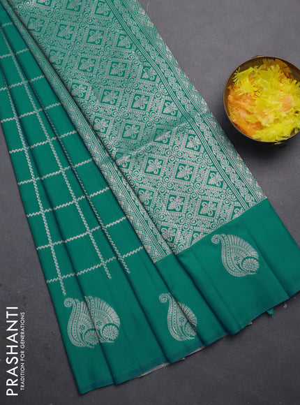Semi soft silk saree teal blue with allover zari woven checked pattern and zari woven butta border