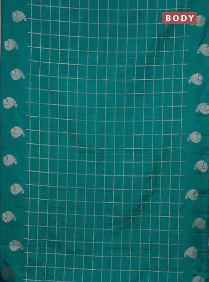 Semi soft silk saree teal blue with allover zari woven checked pattern and zari woven butta border