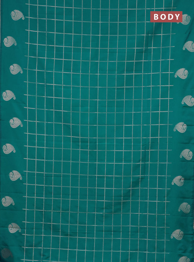 Semi soft silk saree teal blue with allover zari woven checked pattern and zari woven butta border