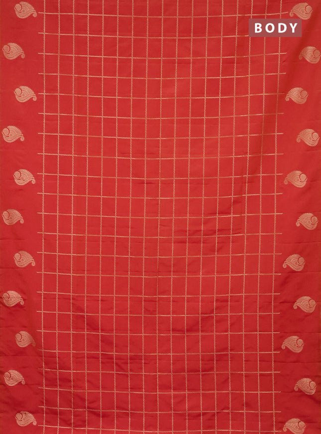 Semi soft silk saree dual shade of pinkish orange with allover zari woven checked pattern and zari woven butta border