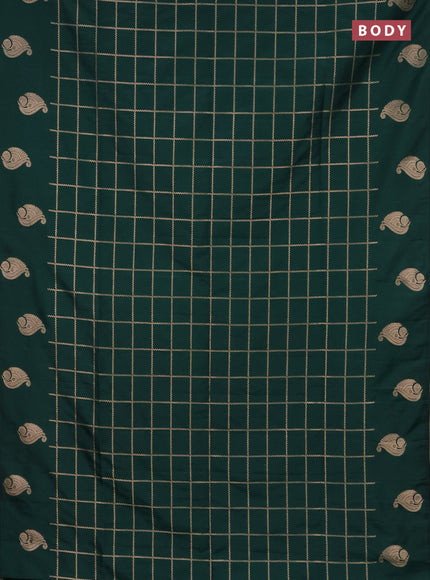 Semi soft silk saree green with allover zari woven checked pattern and zari woven butta border
