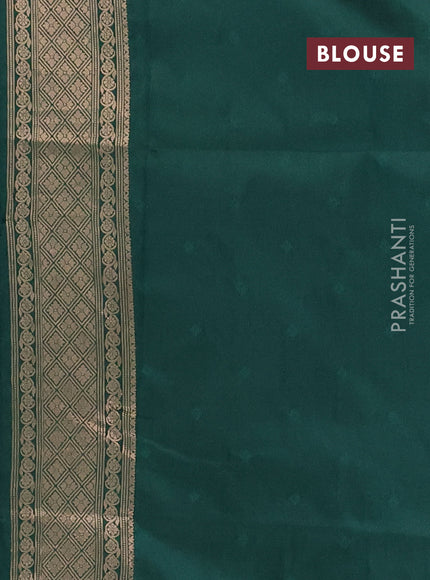 Semi soft silk saree green with allover zari woven checked pattern and zari woven butta border