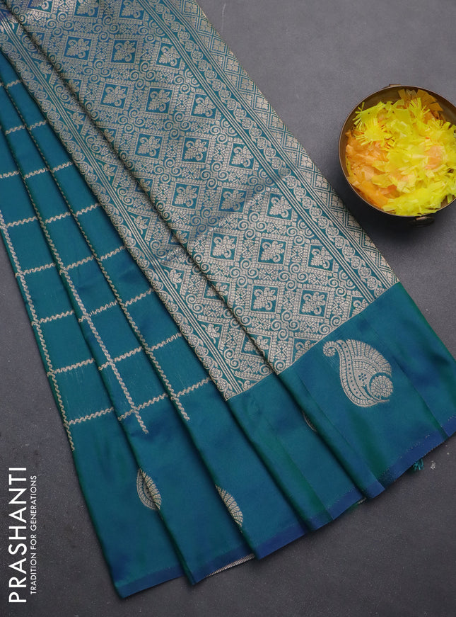 Semi soft silk saree dual shade of greenish blue with allover zari woven checked pattern and zari woven butta border