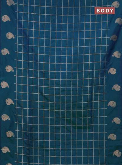 Semi soft silk saree dual shade of greenish blue with allover zari woven checked pattern and zari woven butta border