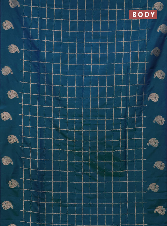 Semi soft silk saree dual shade of greenish blue with allover zari woven checked pattern and zari woven butta border