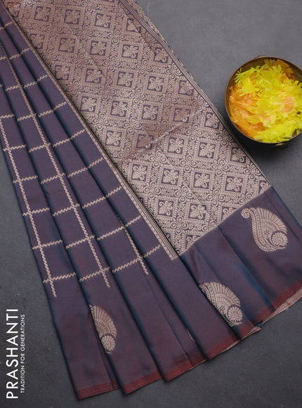Semi soft silk saree dual shade of bluish maroon with allover zari woven checked pattern and zari woven butta border