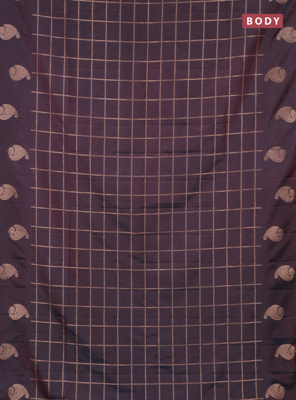 Semi soft silk saree dual shade of bluish maroon with allover zari woven checked pattern and zari woven butta border
