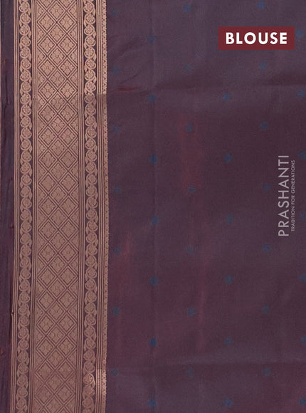 Semi soft silk saree dual shade of bluish maroon with allover zari woven checked pattern and zari woven butta border