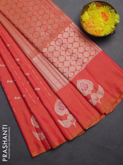 Semi soft silk saree dual shade of pinkish orange with allover zari weaves and zari woven butta border