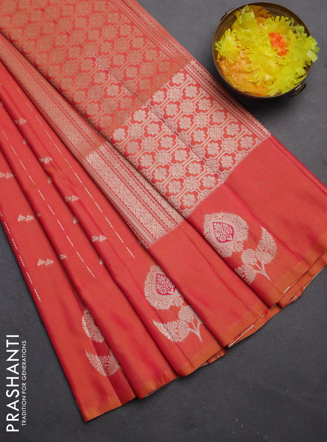 Semi soft silk saree dual shade of pinkish orange with allover zari weaves and zari woven butta border