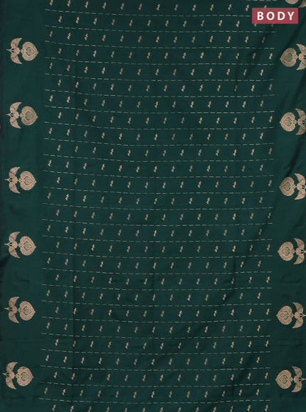 Semi soft silk saree dark green with allover zari weaves and zari woven butta border