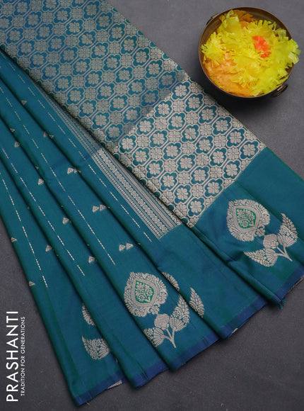 Semi soft silk saree dual shade of bluish green with allover zari weaves and zari woven butta border