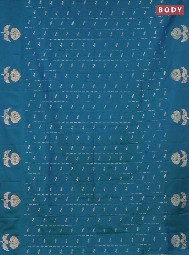 Semi soft silk saree dual shade of bluish green with allover zari weaves and zari woven butta border