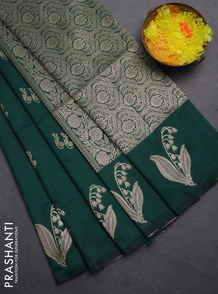 Semi soft silk saree dark green with zari woven buttas and zari woven butta border