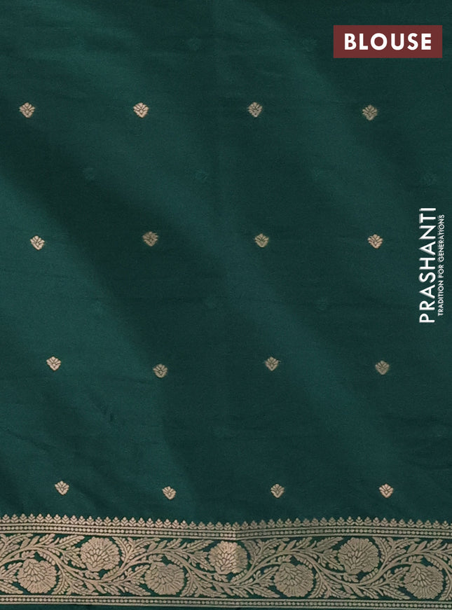 Semi soft silk saree dark green with zari woven buttas and zari woven butta border