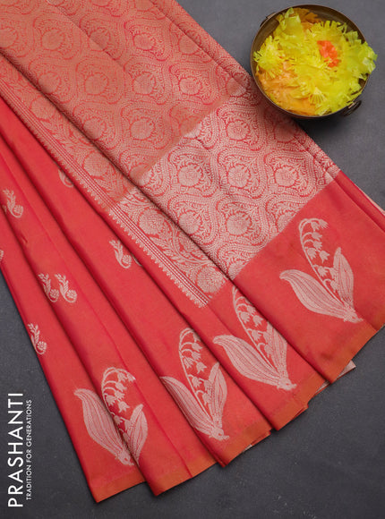 Semi soft silk saree dual shade of pinkish orange with zari woven buttas and zari woven butta border