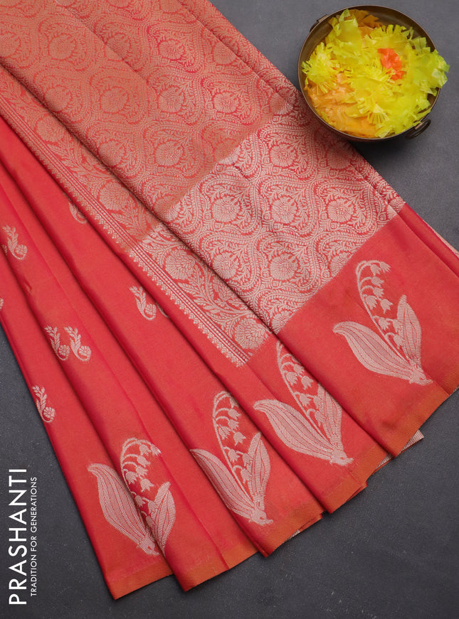Semi soft silk saree dual shade of pinkish orange with zari woven buttas and zari woven butta border