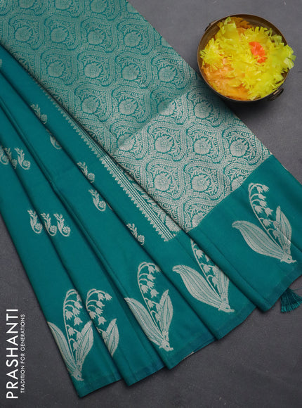 Semi soft silk saree teal blue with zari woven buttas and zari woven butta border