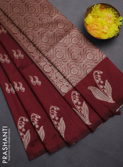 Semi soft silk saree maroon with zari woven buttas and zari woven butta border