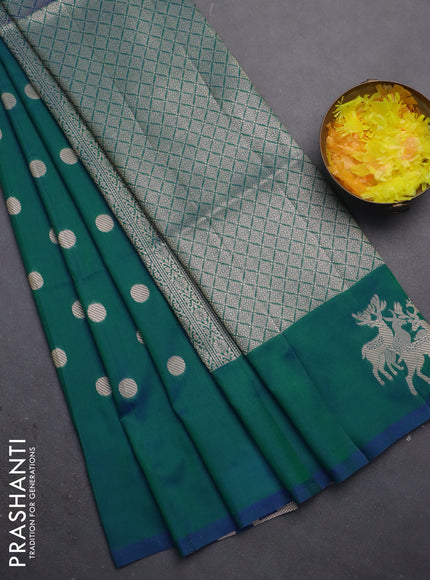 Semi soft silk saree dual shade of greenish blue with zari woven coin buttas and zari woven deer butta border