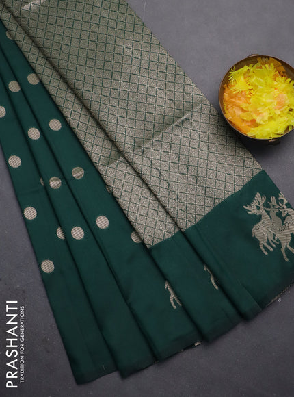 Semi soft silk saree dark green with zari woven coin buttas and zari woven deer butta border