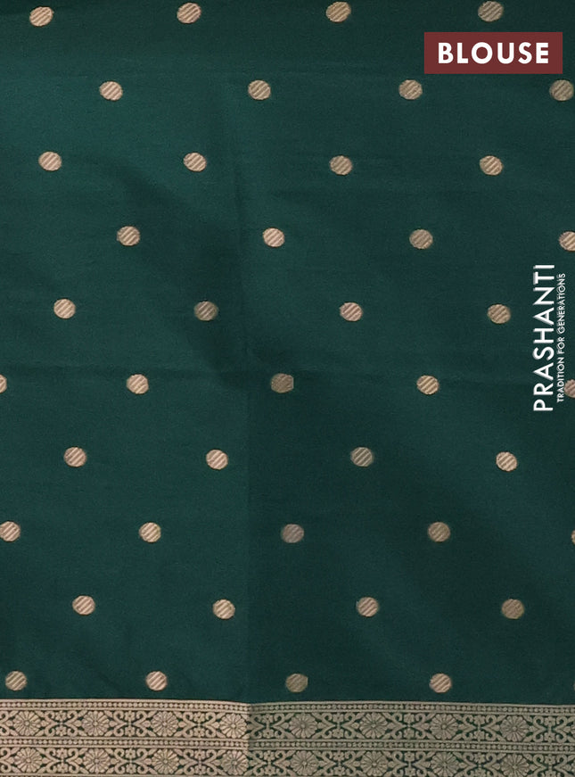 Semi soft silk saree dark green with zari woven coin buttas and zari woven deer butta border