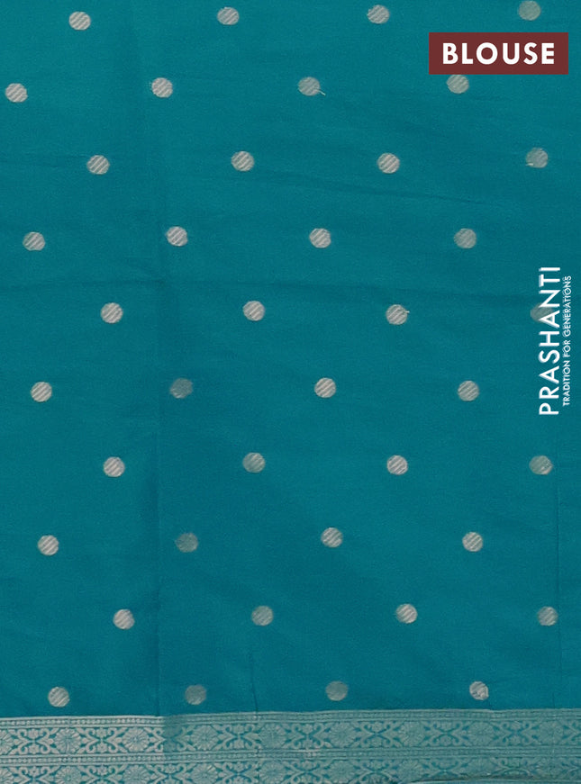 Semi soft silk saree teal blue with zari woven coin buttas and zari woven deer butta border