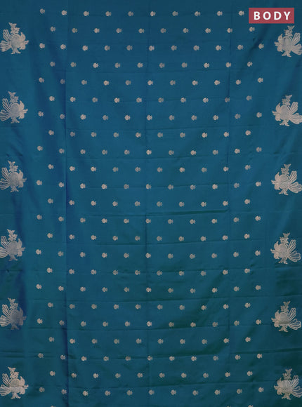 Semi soft silk saree dual shade of bluish green with allover zari woven buttas with zari woven bird butta border