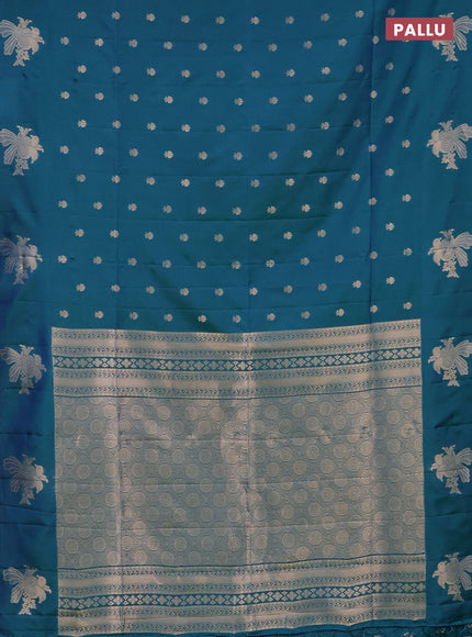 Semi soft silk saree dual shade of bluish green with allover zari woven buttas with zari woven bird butta border