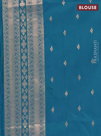 Semi soft silk saree dual shade of bluish green with allover zari woven buttas with zari woven bird butta border